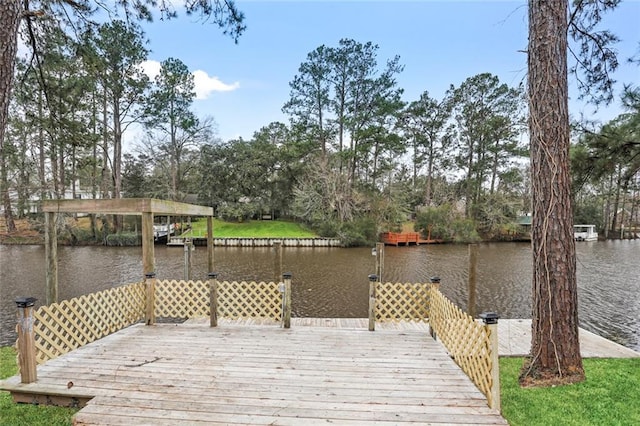 25 Woodvine Ct, Covington, LA 70433 - wooden terrace featuring a water view, view of scattered trees, and a dock