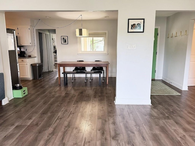 3609 Green Acres Rd, Metairie, LA 70003 - dining room featuring dark wood-style floors and baseboards