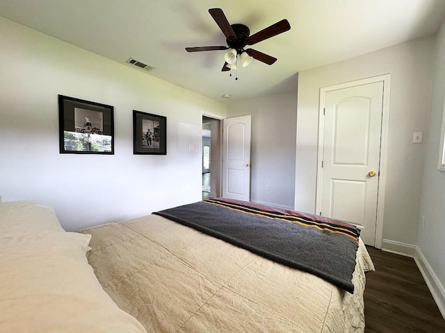 3609 Green Acres Rd, Metairie, LA 70003 - bedroom featuring dark wood-style flooring, baseboards, and a ceiling fan