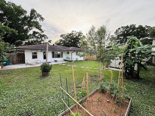 3609 Green Acres Rd, Metairie, LA 70003 - back of property featuring a garden and a patio