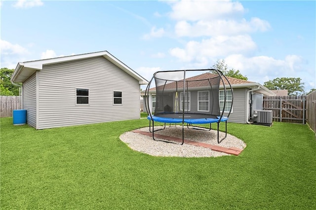 2717 Collette Dr, Marrero, LA 70072 - back of property featuring a trampoline and central AC