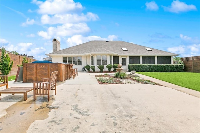 101 Gretel Cv, Slidell, LA 70458 - view of front of house with a chimney, roof with shingles, and a patio area