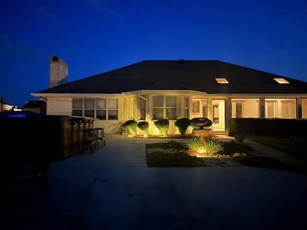 101 Gretel Cv, Slidell, LA 70458 - back of house at night with a chimney
