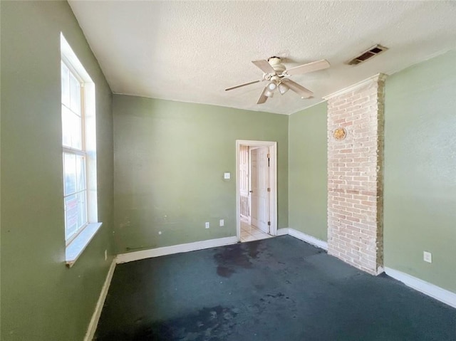 233436 N Miro St, New Orleans, LA 70117 - spare room featuring baseboards, a textured ceiling, carpet floors, and a ceiling fan
