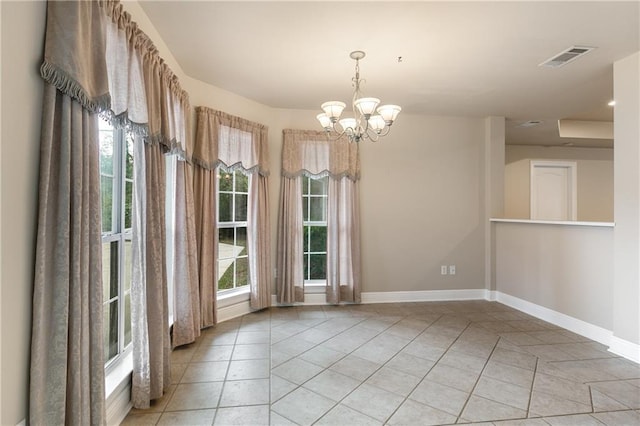 3133 Terrace Ave, Slidell, LA 70458 - unfurnished dining area featuring light tile patterned floors and a chandelier