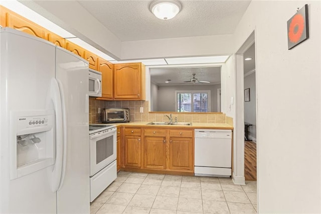201 Avant Garde Cir Unit 201, Kenner, LA 70065 - kitchen featuring white appliances, a sink, tasteful backsplash, a ceiling fan, and light tile patterned floors