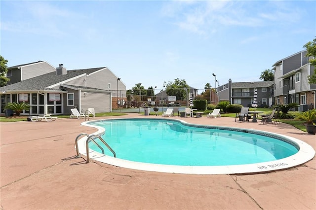 201 Avant Garde Cir Unit 201, Kenner, LA 70065 - community pool featuring a patio and a residential view
