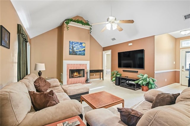 70408 7th St, Covington, LA 70433 - living room with a ceiling fan, lofted ceiling, a tile fireplace, and carpet floors