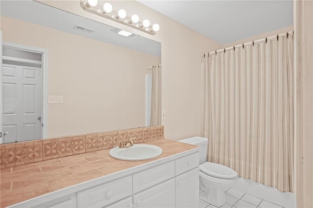 70408 7th St, Covington, LA 70433 - full bathroom with toilet, vanity, tile patterned floors, and a shower with curtain