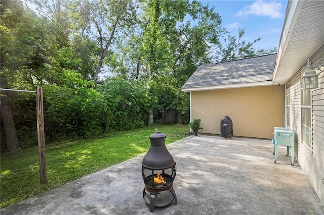 70408 7th St, Covington, LA 70433 - view of patio / terrace featuring a fire pit