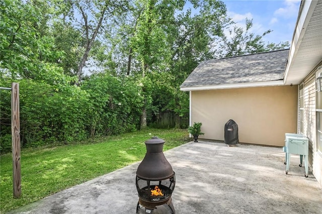 70408 7th St, Covington, LA 70433 - view of patio with an outdoor fire pit