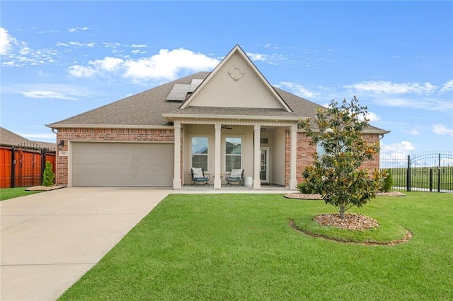 521 Lakeshore Village Ln, Slidell, LA 70461 - view of front of property with brick siding, an attached garage, roof mounted solar panels, concrete driveway, and roof with shingles