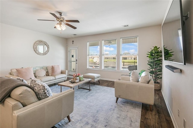 521 Lakeshore Village Ln, Slidell, LA 70461 - living room featuring wood finished floors, baseboards, and ceiling fan
