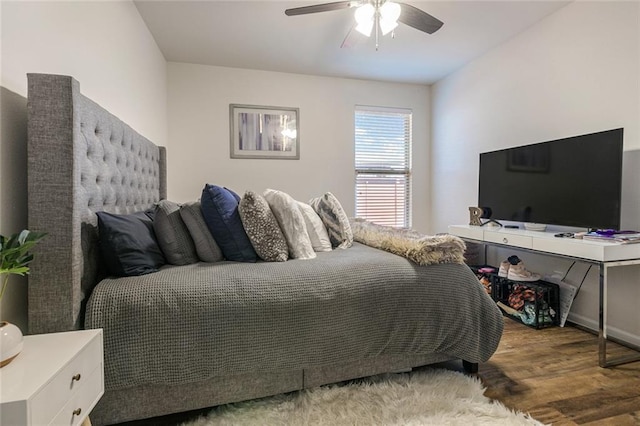 521 Lakeshore Village Ln, Slidell, LA 70461 - bedroom with wood finished floors, a ceiling fan, and baseboards