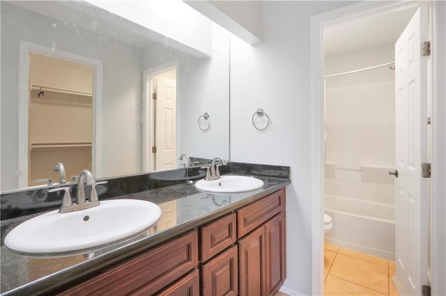 300 Somerset Dr, Slidell, LA 70461 - full bath featuring tile patterned floors, double vanity, toilet, and bathtub / shower combination