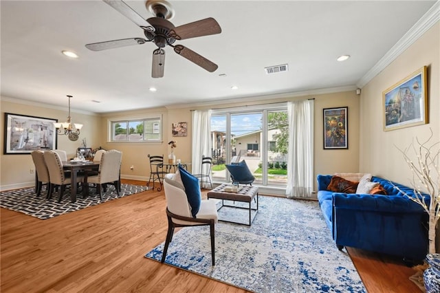 3425 Vincennes Pl, New Orleans, LA 70125 - living area featuring wood finished floors, a chandelier, crown molding, baseboards, and a ceiling fan