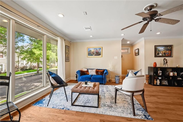 3425 Vincennes Pl, New Orleans, LA 70125 - living area with crown molding, wood finished floors, a ceiling fan, baseboards, and recessed lighting