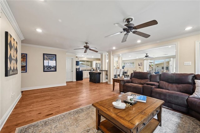 3425 Vincennes Pl, New Orleans, LA 70125 - living room with a ceiling fan, ornamental molding, light wood finished floors, recessed lighting, and baseboards