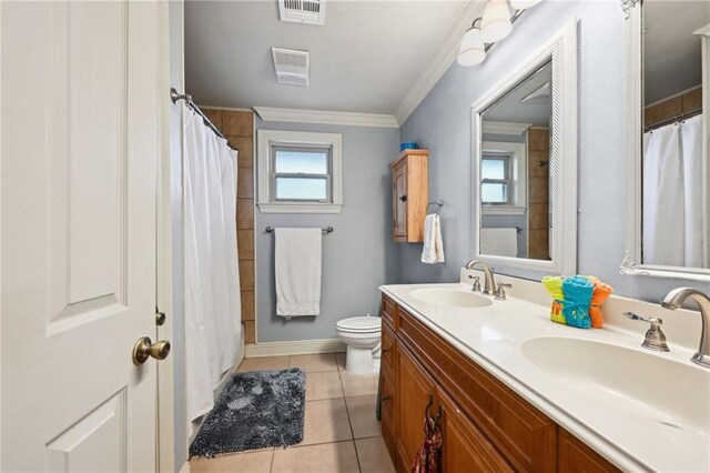 3425 Vincennes Pl, New Orleans, LA 70125 - full bath with tile patterned floors, toilet, double vanity, and crown molding