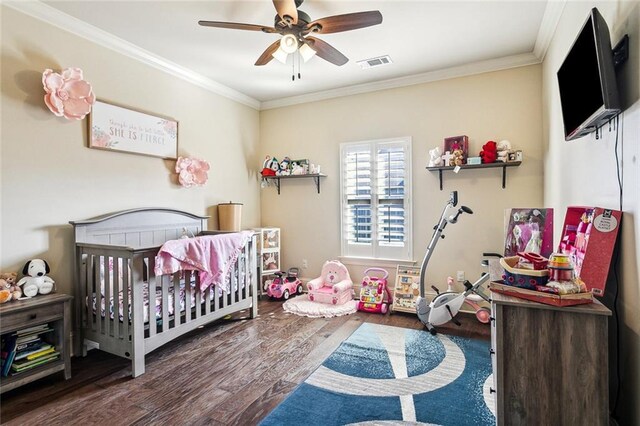 801 Rue Bourdeaux, Covington, LA 70433 - bedroom with wood finished floors, crown molding, a nursery area, and ceiling fan