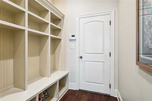 801 Rue Bourdeaux, Covington, LA 70433 - mudroom featuring dark wood-style flooring and baseboards