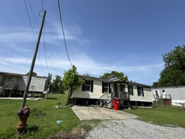 44410 Johnson St, Sorrento, LA 70778 - manufactured / mobile home with a front lawn