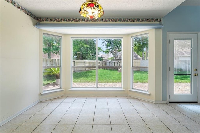 39 Piper Ln, Mandeville, LA 70448 - doorway featuring healthy amount of natural light and baseboards