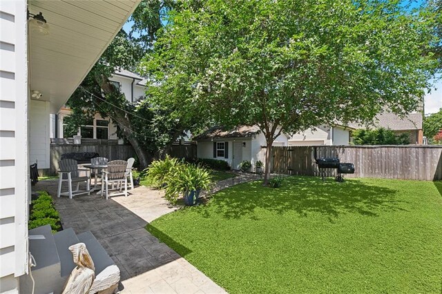 6951 Memphis St, New Orleans, LA 70124 - view of yard featuring a patio area and outdoor dining area