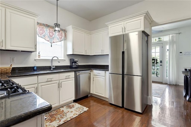 2409-11 St Ann St, New Orleans, LA 70119 - kitchen featuring appliances with stainless steel finishes, a sink, and white cabinets