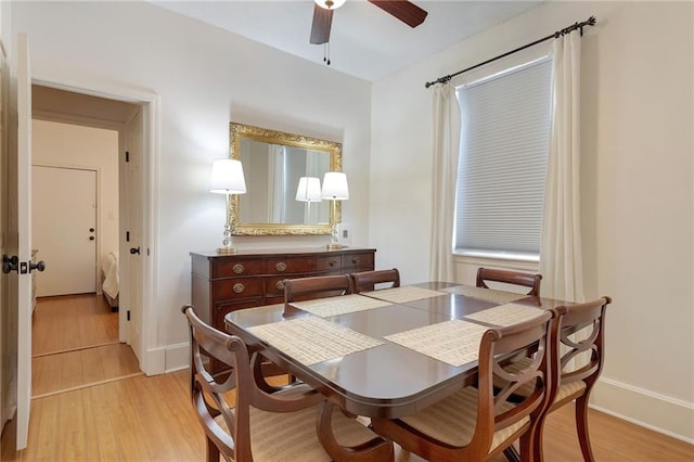 2409-11 St Ann St, New Orleans, LA 70119 - dining area with ceiling fan, light wood-style floors, and baseboards