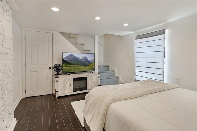 2409-11 St Ann St, New Orleans, LA 70119 - bedroom featuring dark wood-style floors, recessed lighting, and baseboards