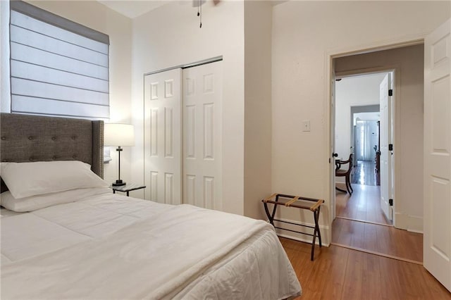 2409-11 St Ann St, New Orleans, LA 70119 - bedroom featuring light wood-type flooring, a closet, and baseboards