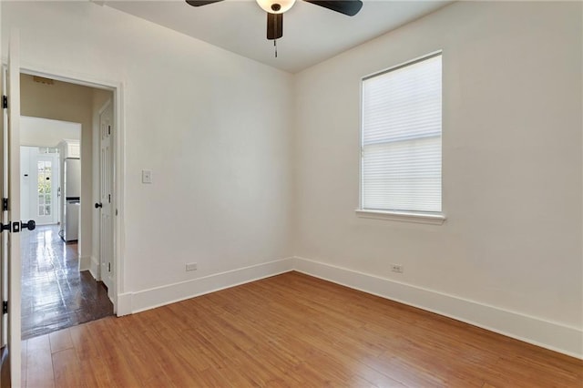 2409-11 St Ann St, New Orleans, LA 70119 - unfurnished room with baseboards, a ceiling fan, and light wood-type flooring