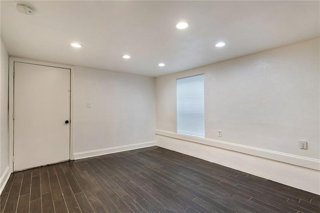 2409-11 St Ann St, New Orleans, LA 70119 - empty room featuring dark wood-style flooring, baseboards, recessed lighting, and a smoke detector