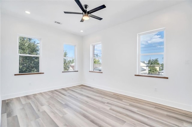 330103 S Saratoga St, New Orleans, LA 70115 - unfurnished room with healthy amount of natural light, light wood finished floors, recessed lighting, baseboards, and ceiling fan