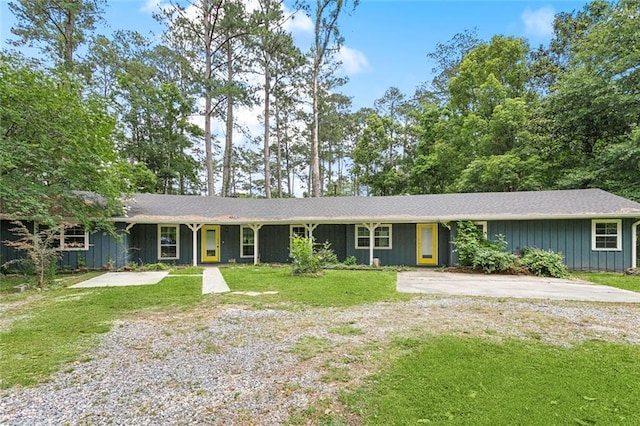 72430 Bullard St, Covington, LA 70435 - ranch-style house with a front yard, board and batten siding, and concrete driveway