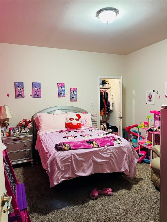 1393 Shipyard Dr, Slidell, LA 70461 - bedroom featuring carpet and a walk in closet