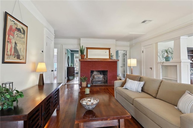 4462 Lafaye St, New Orleans, LA 70122 - living area featuring dark wood-type flooring and a brick fireplace
