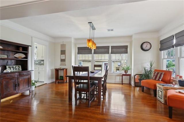 4462 Lafaye St, New Orleans, LA 70122 - dining room with wood finished floors and crown molding