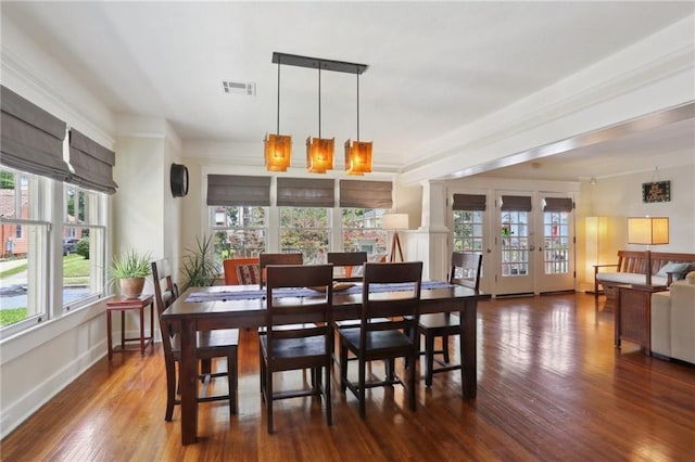 4462 Lafaye St, New Orleans, LA 70122 - dining area with plenty of natural light and wood finished floors