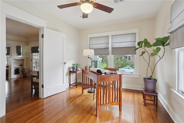 4462 Lafaye St, New Orleans, LA 70122 - home office featuring ceiling fan, wood finished floors, and baseboards