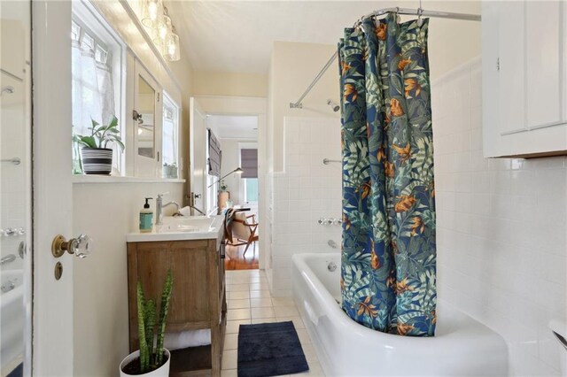 4462 Lafaye St, New Orleans, LA 70122 - bathroom featuring shower / tub combo, healthy amount of natural light, tile patterned floors, and vanity