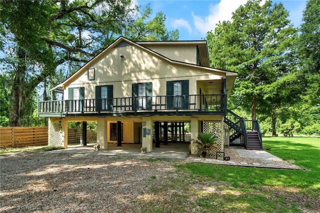 10152 Lawrence Rd, Hammond, LA 70403 - rear view of property with stairs, a carport, and a deck