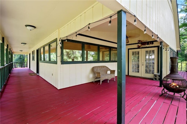 10152 Lawrence Rd, Hammond, LA 70403 - wooden terrace with french doors and an outdoor fire pit