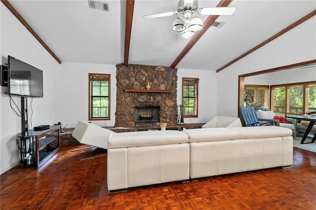10152 Lawrence Rd, Hammond, LA 70403 - living room featuring plenty of natural light, a stone fireplace, and a ceiling fan