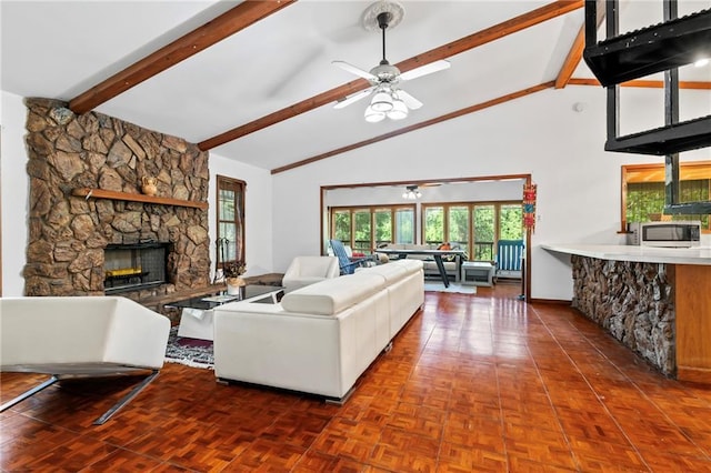 10152 Lawrence Rd, Hammond, LA 70403 - living room featuring a stone fireplace, a ceiling fan, high vaulted ceiling, beam ceiling, and baseboards