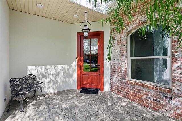 117 Coushatta Cir, Madisonville, LA 70447 - view of exterior entry with brick siding and stucco siding