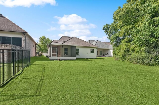 117 Coushatta Cir, Madisonville, LA 70447 - rear view of house featuring a sunroom