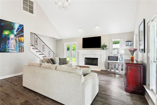 265 Cindy Lou Pl, Mandeville, LA 70448 - living room with high vaulted ceiling, dark wood finished floors, stairway, a premium fireplace, and baseboards