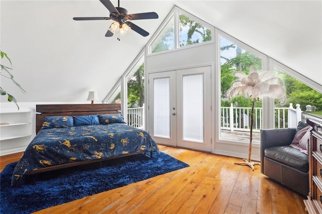 265 Cindy Lou Pl, Mandeville, LA 70448 - bedroom featuring access to exterior, wood-type flooring, french doors, a ceiling fan, and high vaulted ceiling
